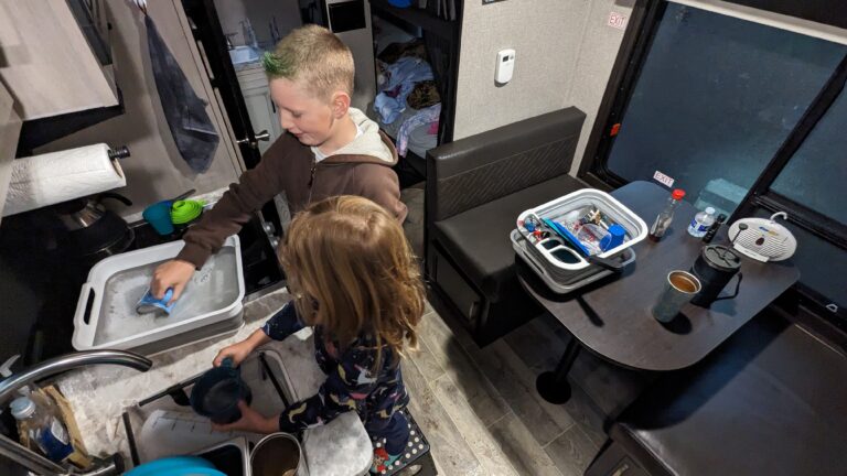 washing dishes in small trailer